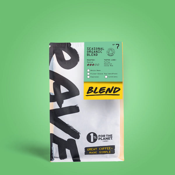 250g Coffee bag labeled 'Seasonal Organic Blend' with Rave branding and text on a light green background