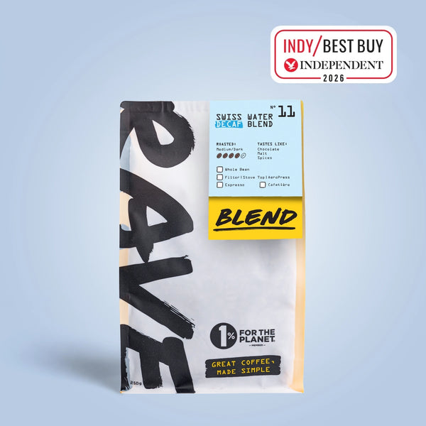 250g Coffee bag labeled 'Swiss Water Decaf Blend' with Rave branding and text on a light blue background. Independent 2026/ best buy stamp