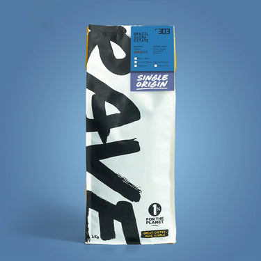 1kg Coffee bag labeled 'Brazil Guima Estate' with Rave branding and text on a blue background