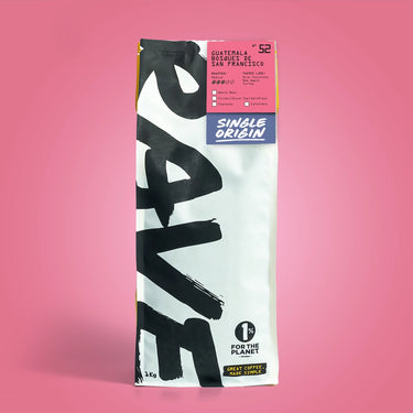 1kg Coffee bag labeled 'Guatemala Bosques De San Francisco' with Rave branding and text on a pinkish-red background