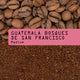 photo of whole roasted Coffee bean and ground coffee with a pink label reading 'GUATEMALA BOSQUES DE SAN FRANCISCO Medium'.