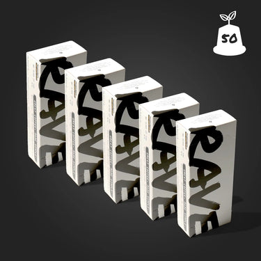 Five white rectangular boxes with bold black “RAVE” text, containing Strong AF Blend Coffee Pods, are arranged diagonally on a dark background. A plant sprout icon with “50” at the top right highlights their compostable pods.