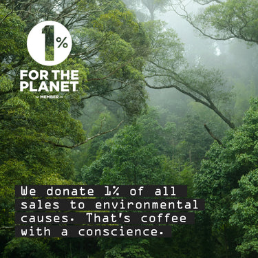 A misty green forest scene with a white circular logo reading '1% FOR THE PLANET MEMBER' and dark text stating, 'We donate 1% of all sales to environmental causes. That's coffee with a conscience.