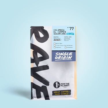 250g Coffee bag labeled 'Colombia el carmen sugarcane, Decaf' with Rave branding and text on a light blue background