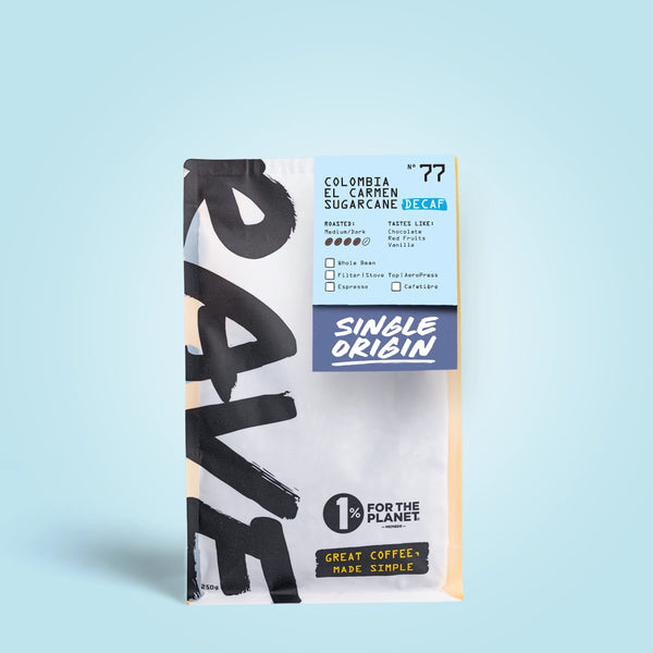 250g Coffee bag labeled 'Colombia el carmen sugarcane, Decaf' with Rave branding and text on a light blue background