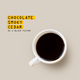 A top-down view of a white ceramic coffee mug filled with black coffee on a light beige background, with text on the left reading 'CHOCOLATE SMOKY CEDAR AS A BLACK FILTER'.