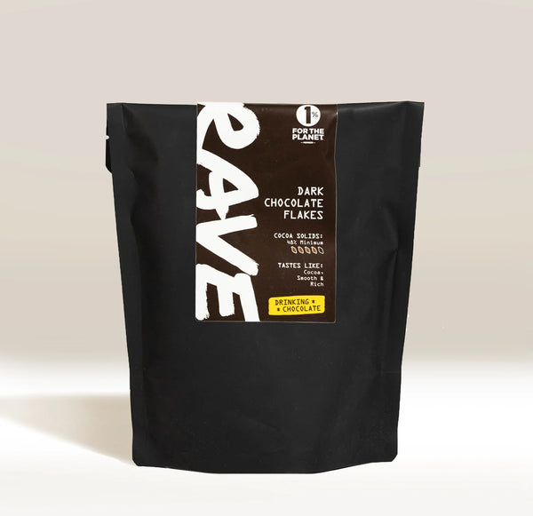 Black bag of RAVE dark chocolate flakes on a light background